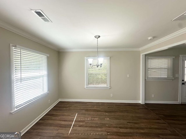2469 Baywood Dr SE, Atlanta, GA 30315 - empty room with a chandelier, crown molding, baseboards, and dark wood finished floors