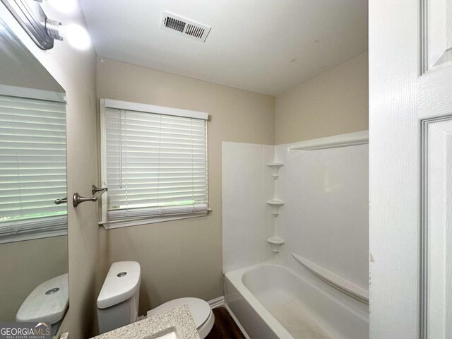 2469 Baywood Dr SE, Atlanta, GA 30315 - full bathroom featuring toilet, tub / shower combination, and baseboards