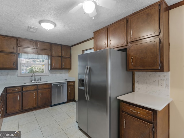 1001 Stagecoach Rd, Stockbridge, GA 30281 - kitchen with appliances with stainless steel finishes, a sink, backsplash, light countertops, and ceiling fan