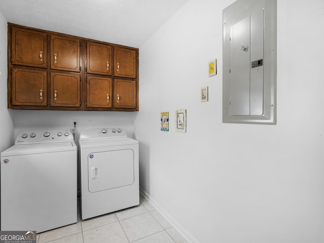 1001 Stagecoach Rd, Stockbridge, GA 30281 - laundry room with electric panel, cabinet space, washer and dryer, baseboards, and light tile patterned floors
