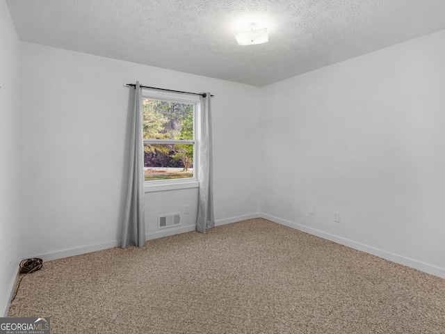 1001 Stagecoach Rd, Stockbridge, GA 30281 - carpeted empty room with a textured ceiling and baseboards