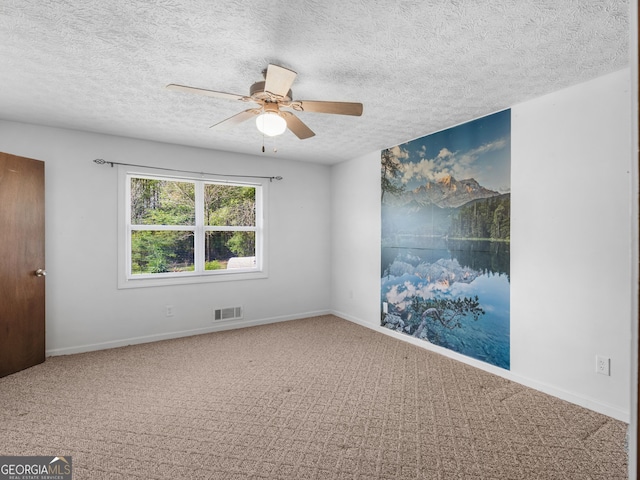 1001 Stagecoach Rd, Stockbridge, GA 30281 - spare room with a ceiling fan, carpet, a textured ceiling, and baseboards