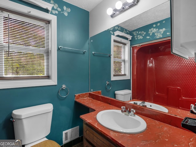 1001 Stagecoach Rd, Stockbridge, GA 30281 - bathroom with toilet, vanity, curtained shower, and a textured ceiling
