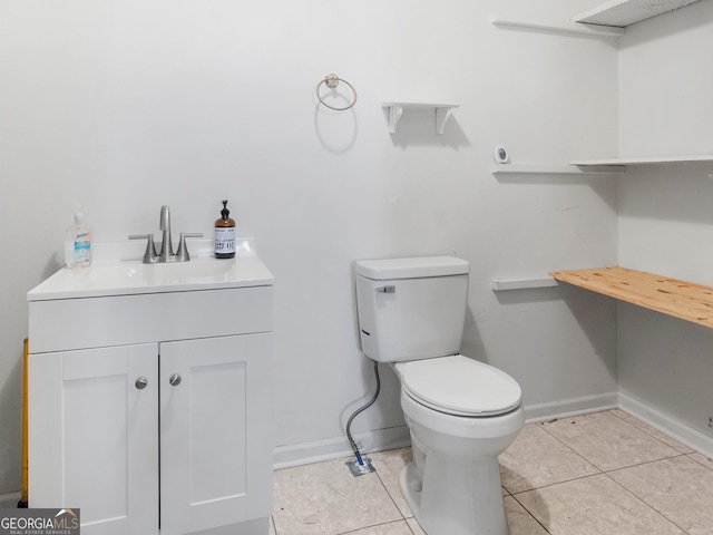 1001 Stagecoach Rd, Stockbridge, GA 30281 - half bathroom with toilet, vanity, tile patterned floors, and baseboards