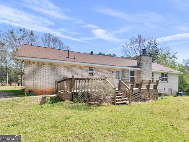1001 Stagecoach Rd, Stockbridge, GA 30281 - rear view of property with brick siding, a lawn, and a deck