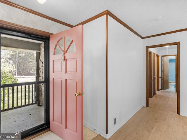 1001 Stagecoach Rd, Stockbridge, GA 30281 - foyer with crown molding and light wood-style floors