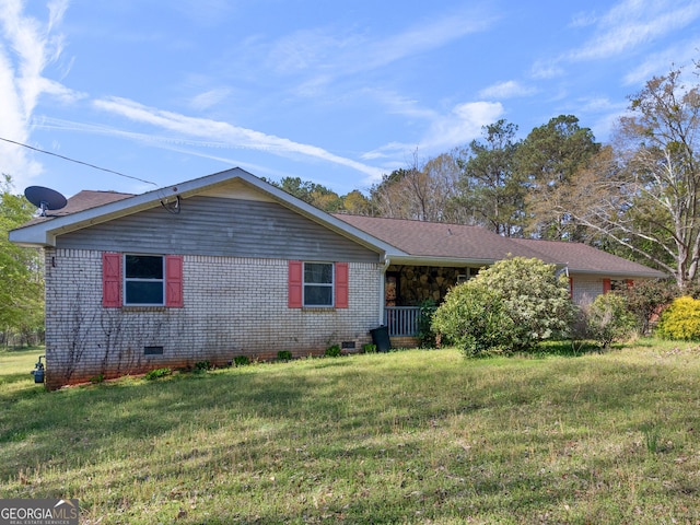 1001 Stagecoach Rd, Stockbridge, GA 30281 - view of front facade with crawl space, a front lawn, and brick siding