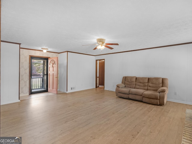 1001 Stagecoach Rd, Stockbridge, GA 30281 - living area with ceiling fan, light wood-style floors, ornamental molding, and baseboards