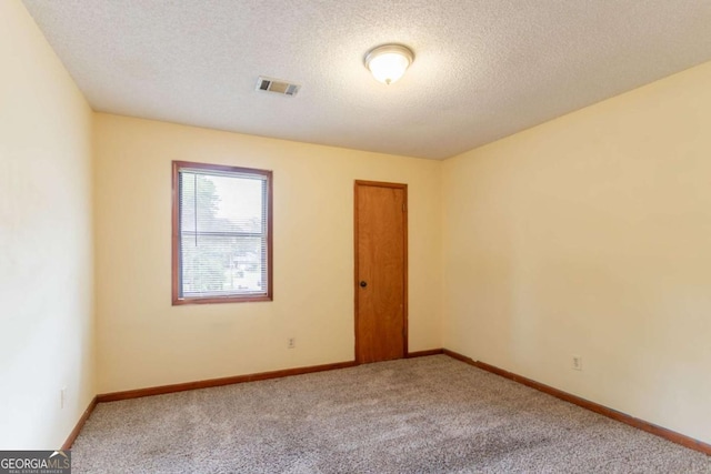 3440 Quinn Ridge Dr, Snellville, GA 30039 - carpeted spare room with a textured ceiling and baseboards