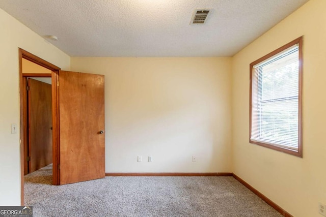 3440 Quinn Ridge Dr, Snellville, GA 30039 - unfurnished room with carpet floors and a textured ceiling