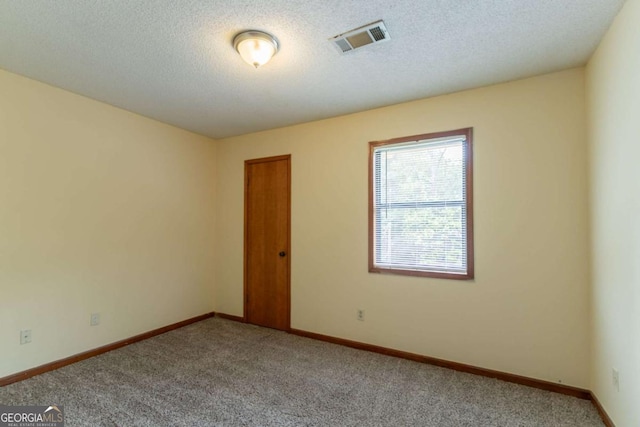 3440 Quinn Ridge Dr, Snellville, GA 30039 - carpeted empty room featuring a textured ceiling and baseboards