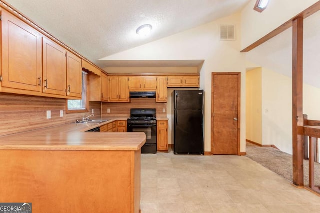 3440 Quinn Ridge Dr, Snellville, GA 30039 - kitchen featuring black appliances, lofted ceiling, light countertops, under cabinet range hood, and backsplash