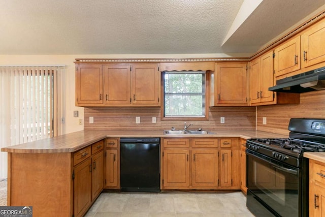 3440 Quinn Ridge Dr, Snellville, GA 30039 - kitchen featuring black appliances, under cabinet range hood, a peninsula, tasteful backsplash, and light countertops