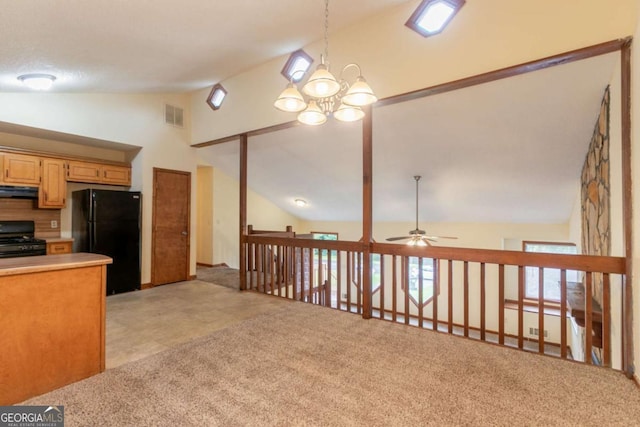 3440 Quinn Ridge Dr, Snellville, GA 30039 - kitchen with black appliances, light countertops, range hood, ceiling fan, and a chandelier