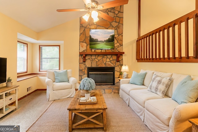 3440 Quinn Ridge Dr, Snellville, GA 30039 - living area featuring a ceiling fan, a stone fireplace, carpet, and high vaulted ceiling