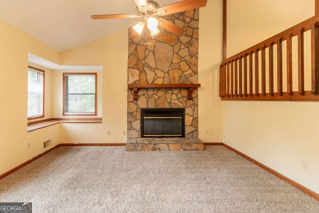 3440 Quinn Ridge Dr, Snellville, GA 30039 - unfurnished living room featuring lofted ceiling, a ceiling fan, carpet, and a fireplace