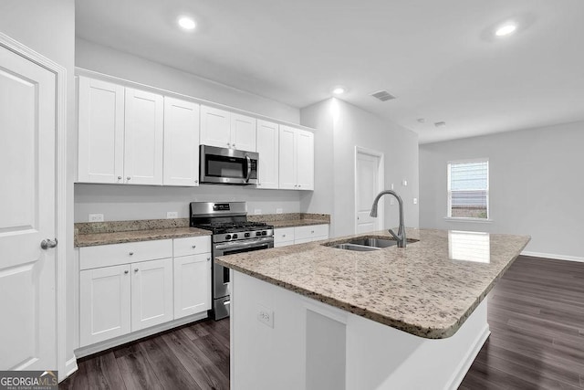 1998 Nuthatch Dr, Hoschton, GA 30548 - kitchen featuring stainless steel appliances, a sink, dark wood-style flooring, white cabinetry, and recessed lighting