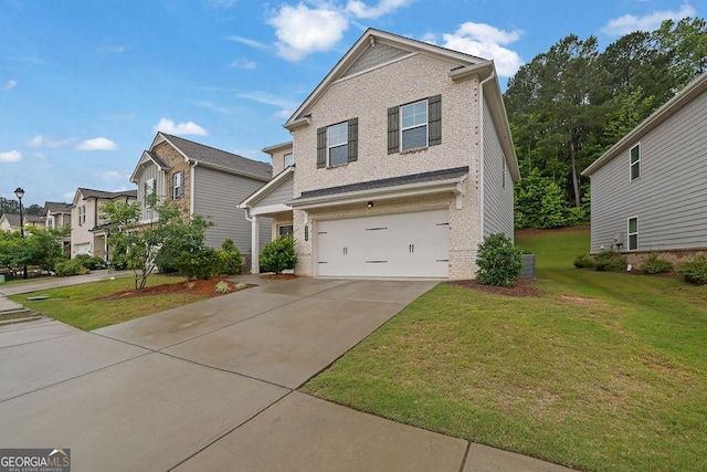 1998 Nuthatch Dr, Hoschton, GA 30548 - view of front facade featuring brick siding, a garage, a front yard, and concrete driveway