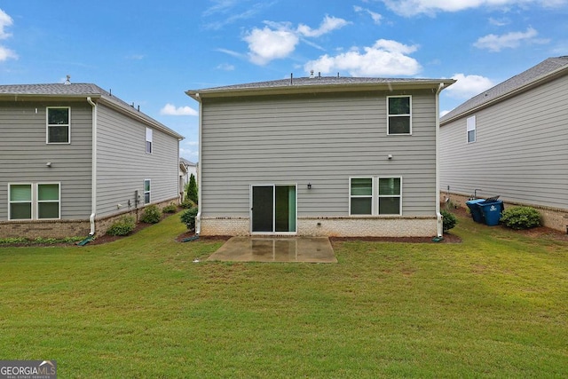 1998 Nuthatch Dr, Hoschton, GA 30548 - back of house featuring a patio area, a lawn, and brick siding
