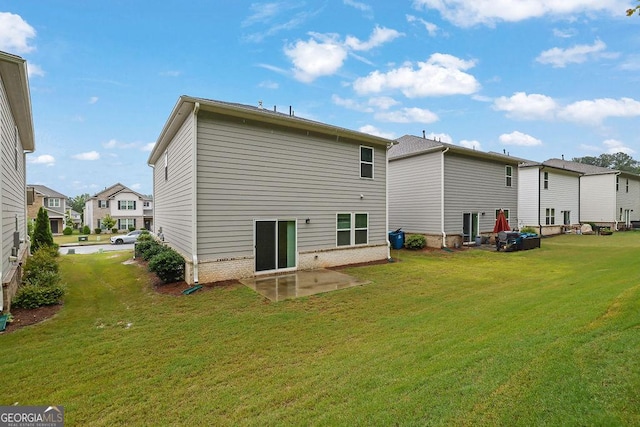 1998 Nuthatch Dr, Hoschton, GA 30548 - back of property featuring a lawn, a patio, and a residential view