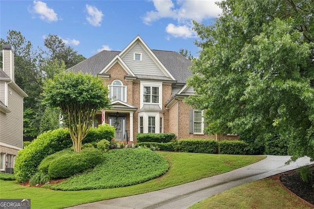 3665 Pennington Rd, Cumming, GA 30041 - view of front of home featuring brick siding and a front yard