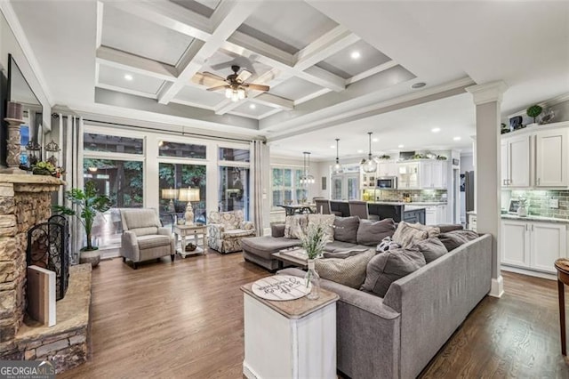 3665 Pennington Rd, Cumming, GA 30041 - living room with ceiling fan, dark wood-style floors, beamed ceiling, crown molding, and decorative columns