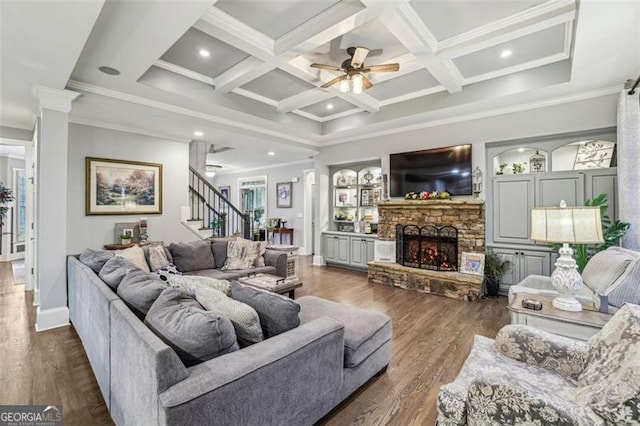 3665 Pennington Rd, Cumming, GA 30041 - living room featuring stairs, ceiling fan, beam ceiling, a fireplace, and coffered ceiling