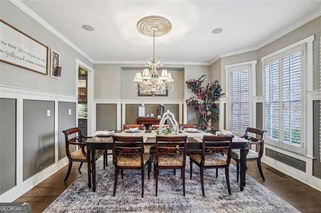 3665 Pennington Rd, Cumming, GA 30041 - dining space featuring ornamental molding, a chandelier, and dark wood-style floors