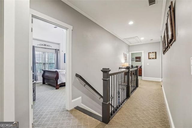 3665 Pennington Rd, Cumming, GA 30041 - hallway with attic access, carpet flooring, an upstairs landing, recessed lighting, and crown molding