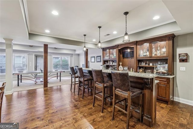 3665 Pennington Rd, Cumming, GA 30041 - indoor wet bar with ornate columns, crown molding, pendant lighting, dark wood-type flooring, and recessed lighting