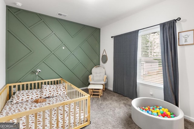 187 Lyndhurst Dr, Bethlehem, GA 30620 - carpeted bedroom with a crib and baseboards
