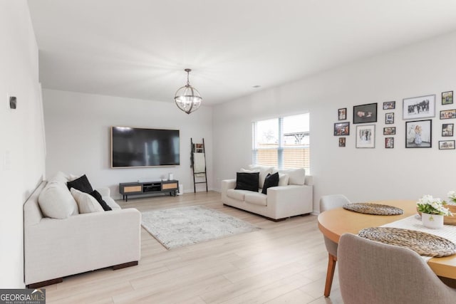 187 Lyndhurst Dr, Bethlehem, GA 30620 - living area with a chandelier and light wood-type flooring