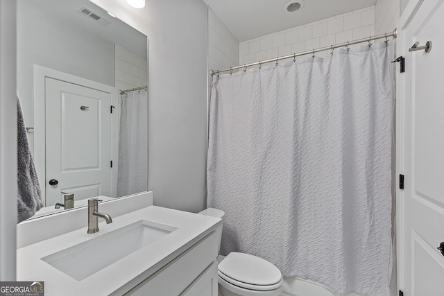 357 Mell Ave Unit A, Atlanta, GA 30307 - bathroom with toilet, vanity, and a shower with shower curtain