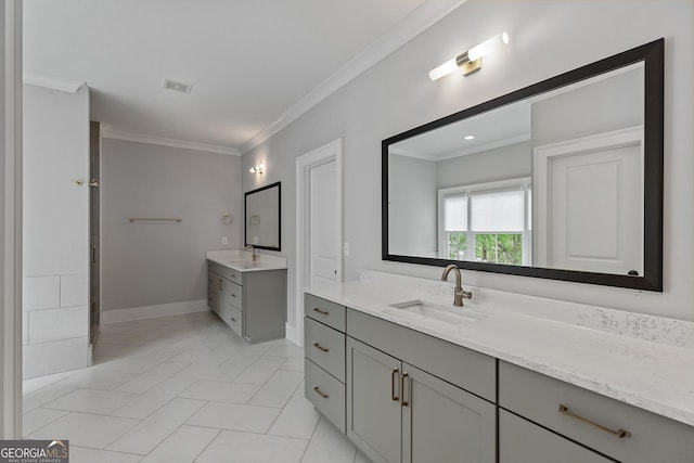 357 Mell Ave Unit A, Atlanta, GA 30307 - bathroom with two vanities, crown molding, and baseboards
