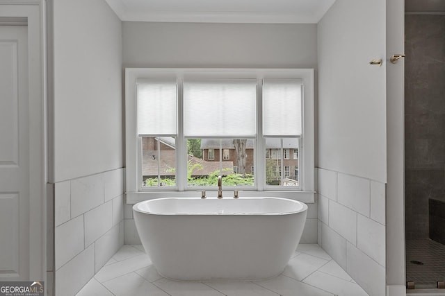 357 Mell Ave Unit A, Atlanta, GA 30307 - full bath with tile walls, a soaking tub, a wainscoted wall, tile patterned floors, and tiled shower