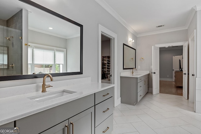 357 Mell Ave Unit A, Atlanta, GA 30307 - full bath with two vanities, a stall shower, crown molding, tile patterned flooring, and recessed lighting
