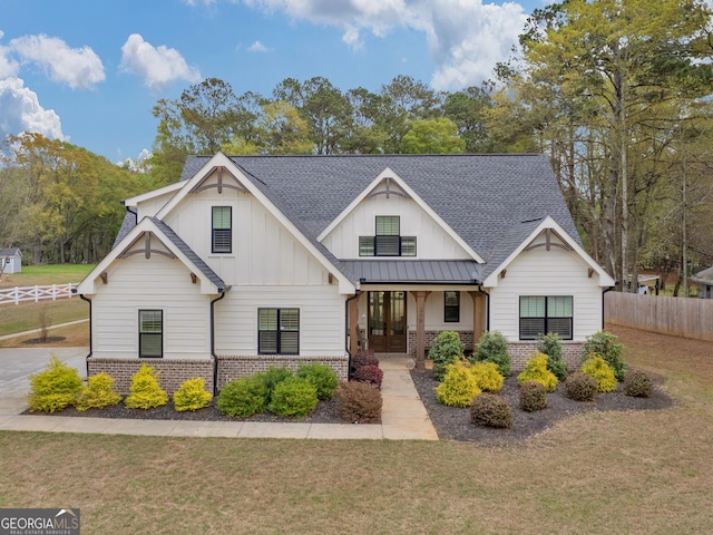 319 S Mount Carmel Rd, Mcdonough, GA 30253 - modern farmhouse featuring brick siding, roof with shingles, board and batten siding, and french doors