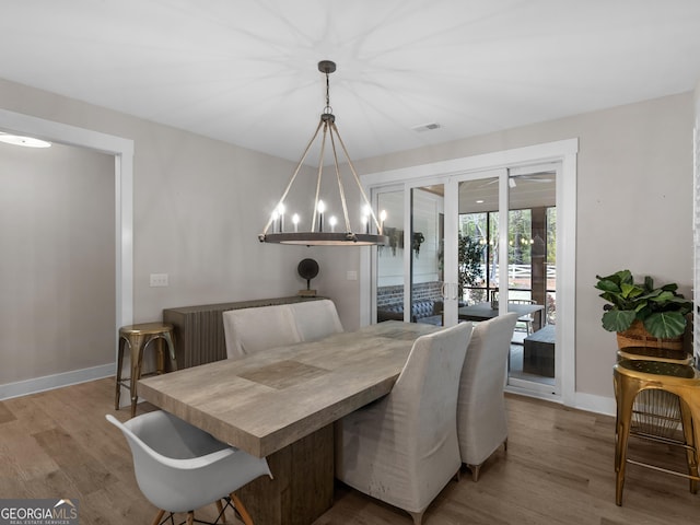 319 S Mount Carmel Rd, Mcdonough, GA 30253 - dining area with baseboards, wood finished floors, french doors, and a chandelier