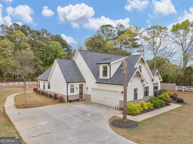 319 S Mount Carmel Rd, Mcdonough, GA 30253 - view of front of property featuring roof with shingles, concrete driveway, a garage, and brick siding