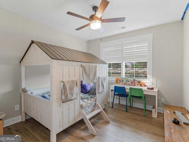 319 S Mount Carmel Rd, Mcdonough, GA 30253 - bedroom featuring wood finished floors, a ceiling fan, and baseboards
