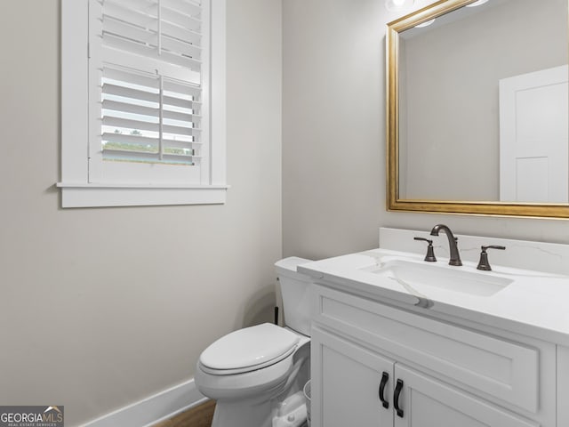 319 S Mount Carmel Rd, Mcdonough, GA 30253 - bathroom featuring vanity, toilet, and baseboards