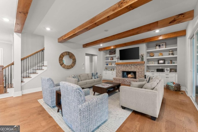 4847 Destitute Way, Gainesville, GA 30506 - living room with stairs, baseboards, light wood-type flooring, beamed ceiling, and a fireplace