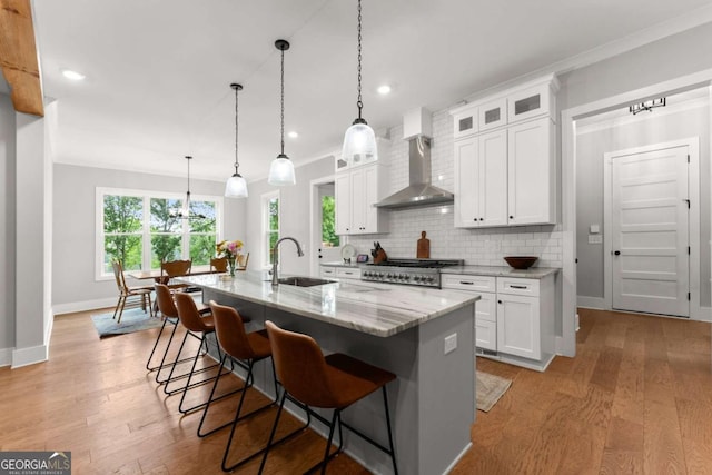 4847 Destitute Way, Gainesville, GA 30506 - kitchen featuring wall chimney range hood, baseboards, light stone countertops, backsplash, and white cabinets