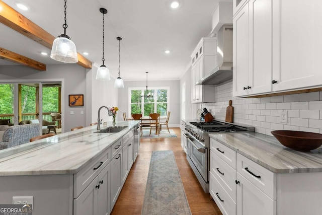 4847 Destitute Way, Gainesville, GA 30506 - kitchen featuring appliances with stainless steel finishes, a sink, wall chimney exhaust hood, recessed lighting, and backsplash