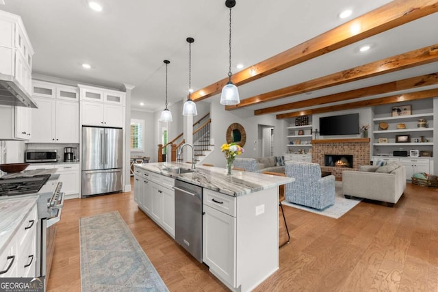 4847 Destitute Way, Gainesville, GA 30506 - kitchen featuring stainless steel appliances, a sink, recessed lighting, a center island with sink, and glass insert cabinets