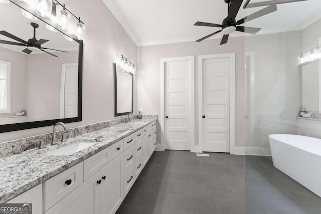 4847 Destitute Way, Gainesville, GA 30506 - bathroom featuring ceiling fan, a freestanding bath, double vanity, baseboards, and tile patterned flooring