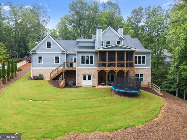 4847 Destitute Way, Gainesville, GA 30506 - back of house featuring a chimney, a trampoline, stairs, and a lawn