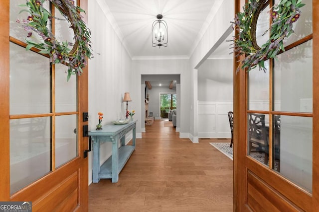 4847 Destitute Way, Gainesville, GA 30506 - foyer featuring light wood finished floors, ornamental molding, and a chandelier