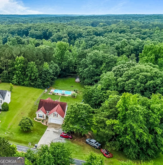161 Mills Dr, Covington, GA 30016 - aerial view of a forest and a pool area