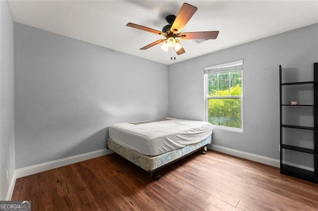 15 Baker St, Dahlonega, GA 30533 - bedroom with wood finished floors and ceiling fan